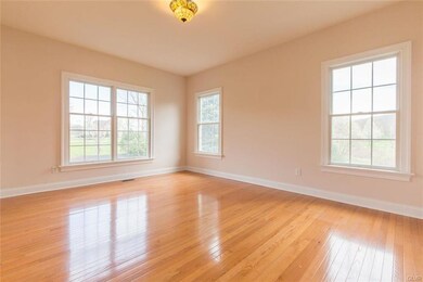 Formal Living room is bright with plenty of window