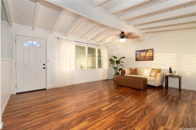 View of the front door entry and spacious living area.
