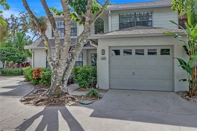 View of front of house with a garage, stucco sidin