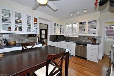Beautifully appointed kitchen has glass door cabin