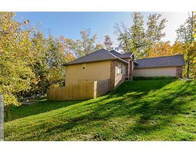 Exterior Back/Side. Home sits on a fully fenced double lot on a cul-de-sac.  NOT easy to find in Bella Vista!
