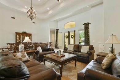 living area with 12 ft ceiling