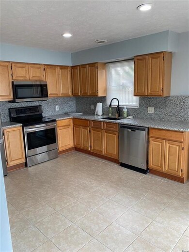 Newly updated Kitchen with cabinets, granite count