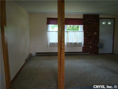 Living Room Opens to Kitchen and Dining Area