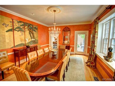 Banquet size dining room, hardwood floor, 4 member crown molding and full length glass door opening to patio