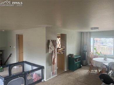 Dining space featuring light colored carpet, visib