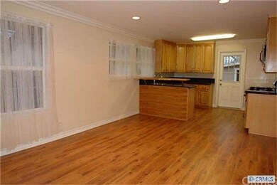 as you enter, you notice the wood flooring and ope