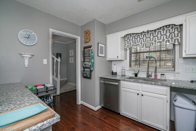 Kitchen has updated sink and faucet, granite counters and recent appliances