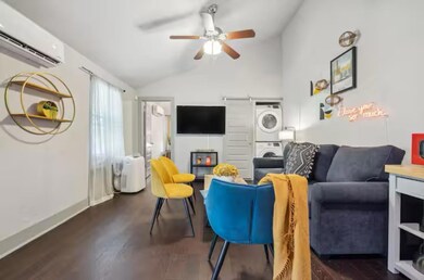 Living area featuring estacked washer and dryer, 