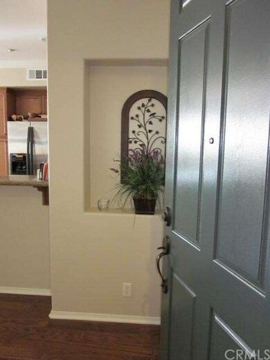 Large entry into foyer and coat closet behind fron