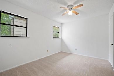 Spare room featuring a textured ceiling, ceiling 