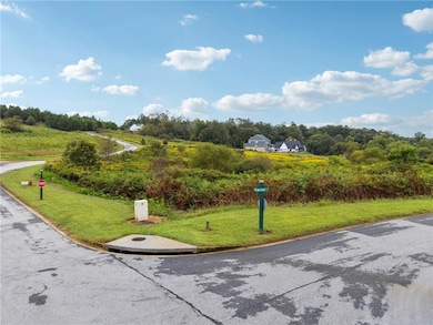 View of home's community with a lawn