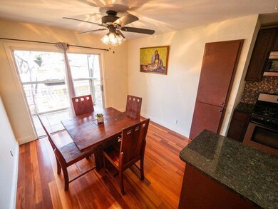 Dining space featuring dark wood-style floors and