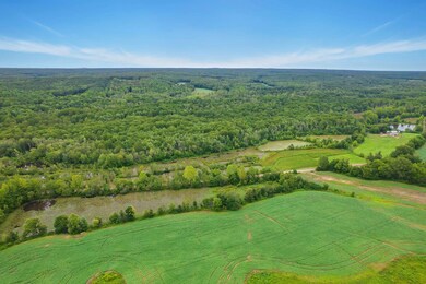 Birds eye view of property featuring a forest view