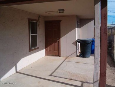 Carport and entry to house