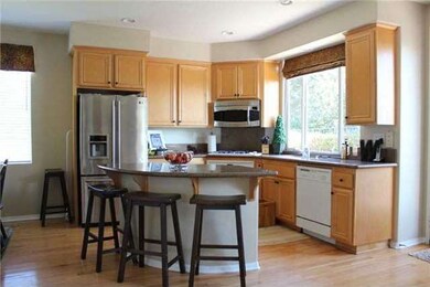Gourmet kitchen with granite, wood floors, island 
