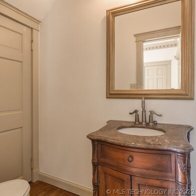 Half bathroom located near the dining room and foy