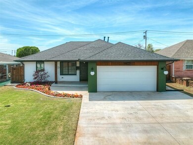 View of front of home featuring concrete driveway,