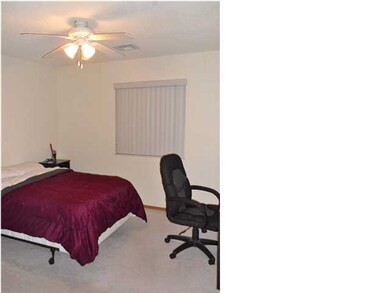 Master bedroom with big closet and ceiling fan