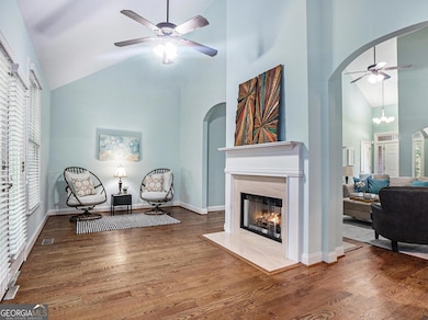 Unique, open floor plan with many defined living spaces - and double-sided freplace