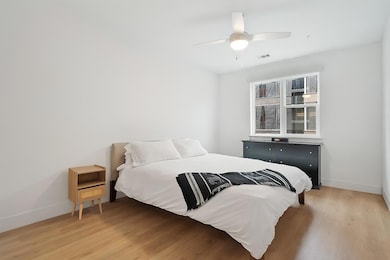 Bedroom with light wood-style floors and a ceilin