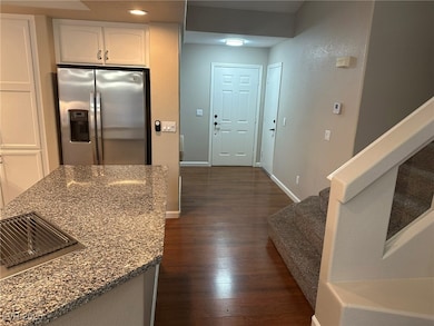 Kitchen with stainless steel fridge