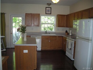 Kitchen is nice size with eat-in area, island, pan