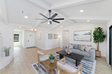 Family Room looking into foyer and hallway to bedrooms.