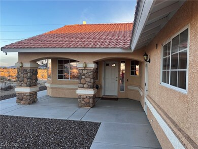 Doorway to property featuring a tiled roof and stu