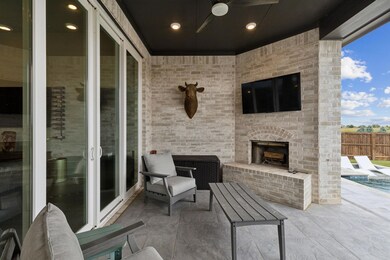 View of patio featuring fence and an outdoor brick