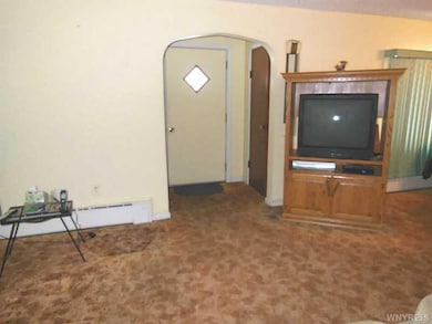 Living Room. Front entrance with 2 closets.