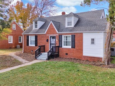 Cape cod-style brick-front house