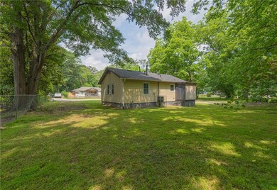 Back of house with a sunroom and crawl space