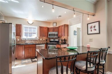 Kitchen with breakfast bar and granite counter top
