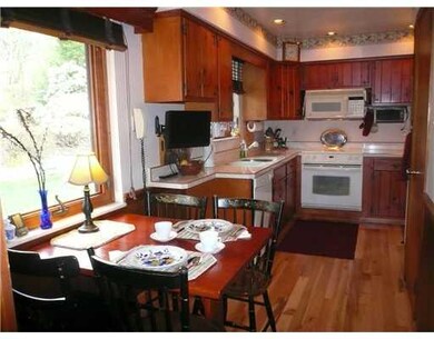 Kitchen. Cozy eat-in area. Kitchen overlooks front