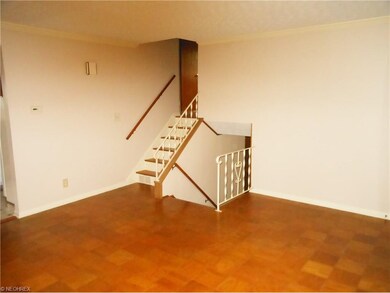 Living room. Stairways to Bedrooms and Family room