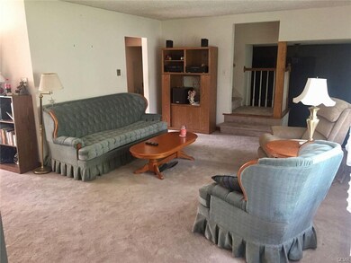 living room looking towards steps to 3rd level