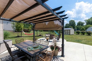 Pergola affords shade while entertaining or meals 