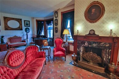 Formal Living room w marble surround fireplace