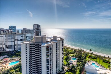 Birds eye view of property with a view of the beac