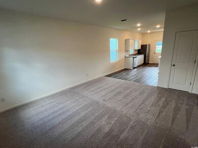 Empty room with carpet flooring