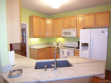 Open Kitchen with hardwood floors and granite tops