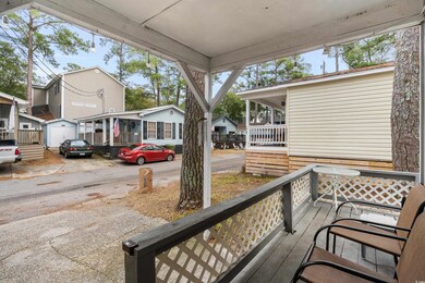 Wooden deck featuring an outbuilding