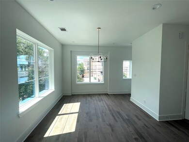 Dining Room * Designer Chandelier * Lots of Window