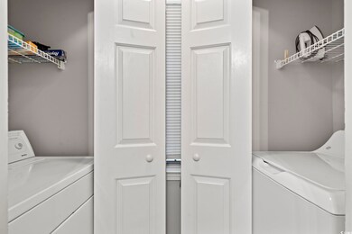 Washroom featuring independent washer and dryer