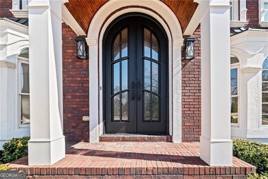 Doorway to property featuring brick siding and fre