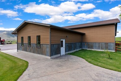 Stamped concrete walkway and patios from the home to the shop.