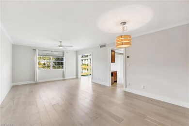 Living room with ornamental molding, ceiling fan, 