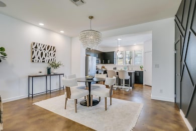 Dining space featuring visible vents, finished co