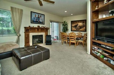 Living room with fireplace & built-in entertainmen